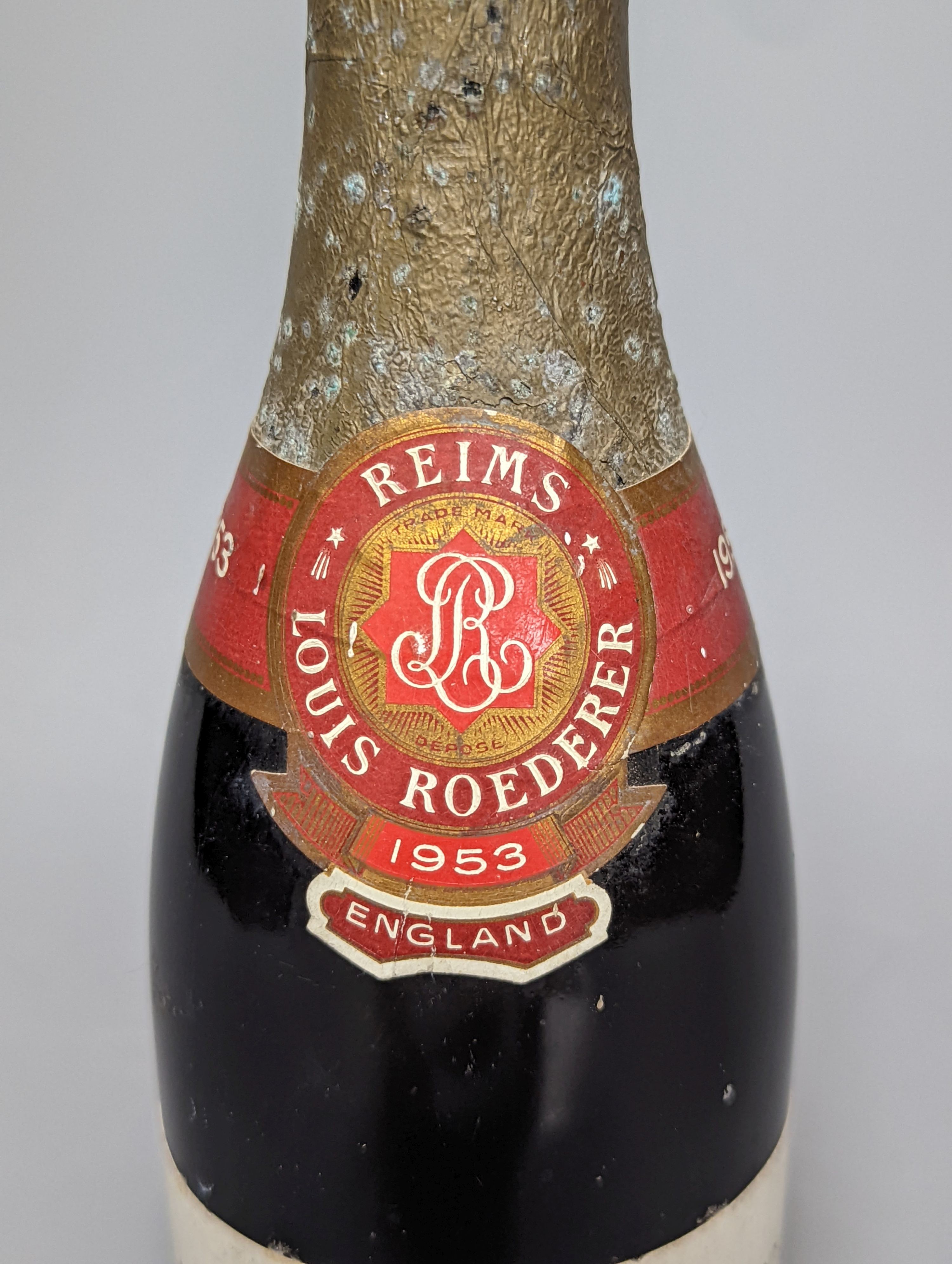 One half bottle of 1953 Louis Roederer extra dry champagne